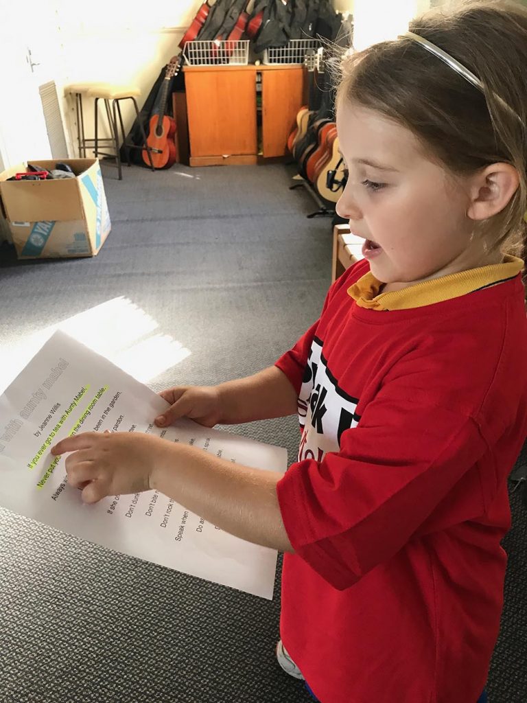 Girl reading for show and tell