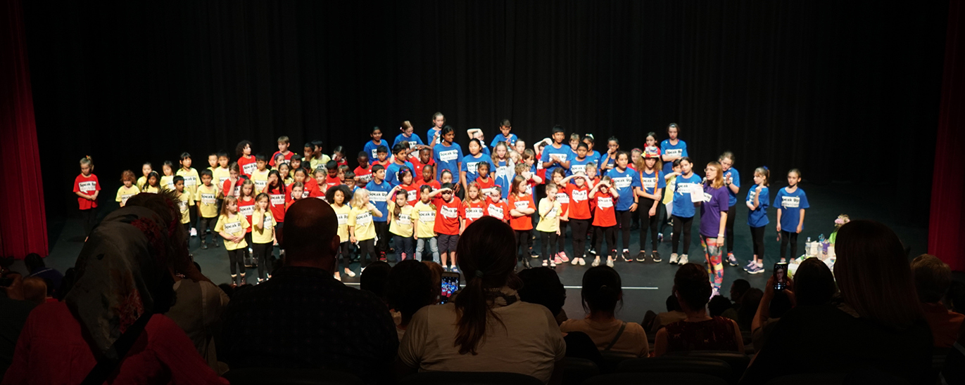 Kids performing on stage